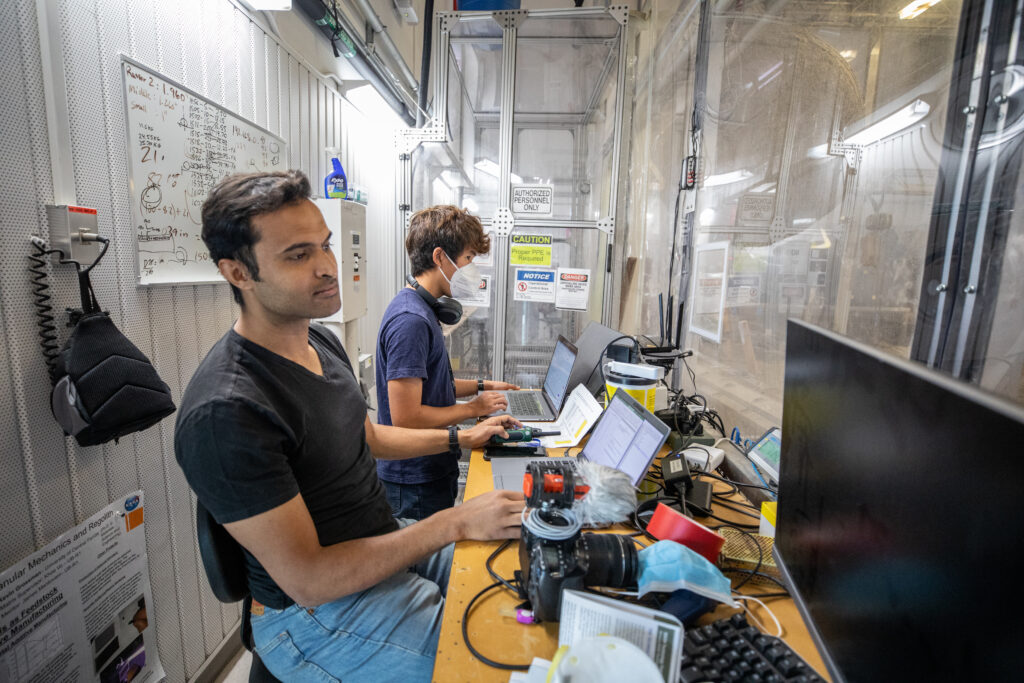 Astrobotic employees run the software for a CubeRover ground test in NASA’s lunar regolith pit at the Granular Mechanics and Regolith Operations Laboratory on June 30, 2022. Software developers are one of the most sought-after occupations in the space industry, and the field has a strong employment outlook over the next decade.