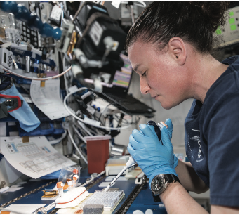 NASA astronaut Serena Auñón-Chancellor mixes protein crystal samples onboard the ISS in the search for new medicines. Credit: JAXA/NASA
