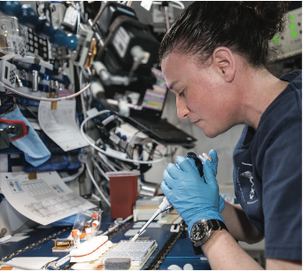 NASA astronaut Serena Auñón-Chancellor mixes protein crystal samples onboard the ISS in the search for new medicines. Credit: JAXA/NASA